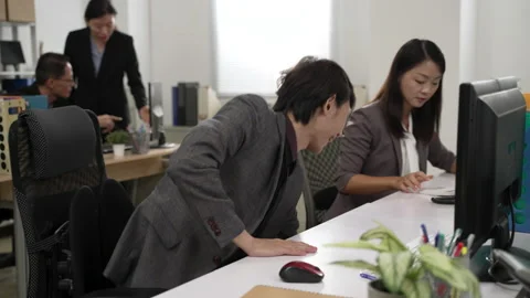 Employee becomes energetic as at getting off time Stock Footage 179844430
