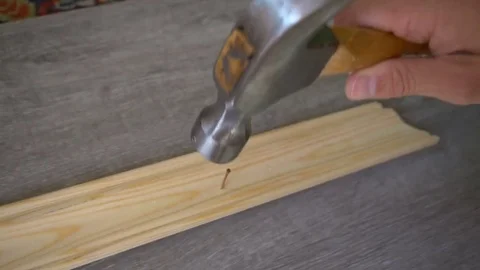 The employee breaks the hammer in his hand when he tried to hammer a nail Stock-Footage 78815534
