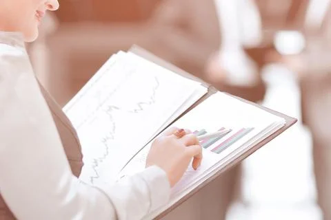 Employee checking financial data standing in the office. business concept Stock Photos