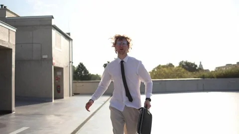 Employee checks smartwatch while walking to work worried about being late Stock-Footage 346362507