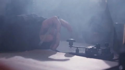 Employee communicates using telegraph and Morse code Stock Footage 228781063