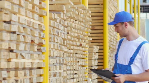 The employee of construction shop does notes in the form Stock Footage 57096883