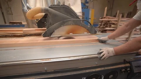 Employee Cutting Wood with a Machine Stock Footage 293540947