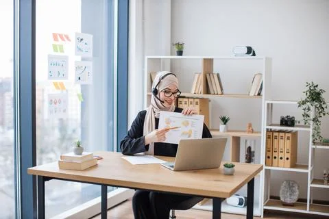 Employee decoding charts on online briefing using devices Stock Photos
