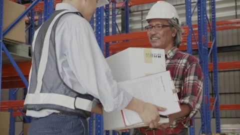 Employee delivery parcel boxes to customer in factory. Foreman or worker checkin Stock Footage 159537019