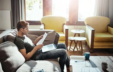 Employee, document and remote work from home with a laptop, planning and 库存照片