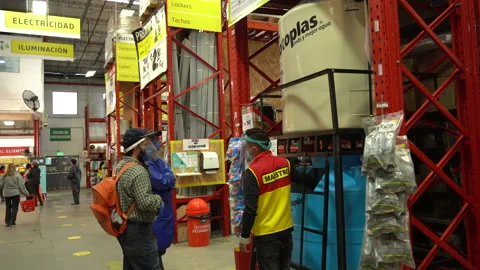 An employee explaining the operation of some water tanks at home Stock Footage 140333592