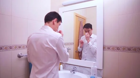 Employee feeling unwell but preparing for work Stock Footage 311791877