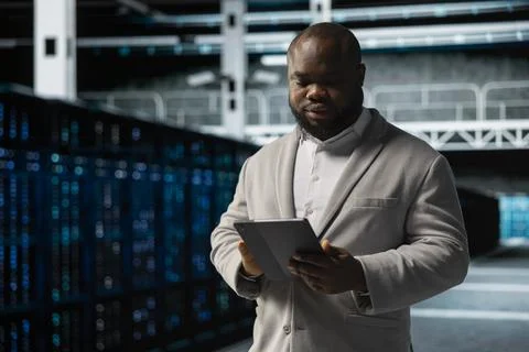 Employee fixing network issues affecting rigs performance 写真素材