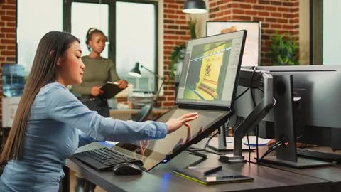 Employee game developer working in creative production department Stock Photos