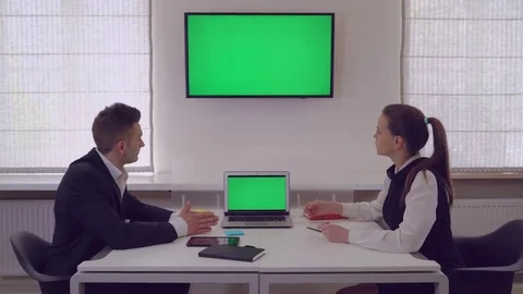 Employee giving presentation for coworker Stock Footage