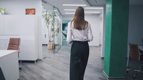 Employee goes around the office with a folder of papers in his hands. young Stock Footage 105395006