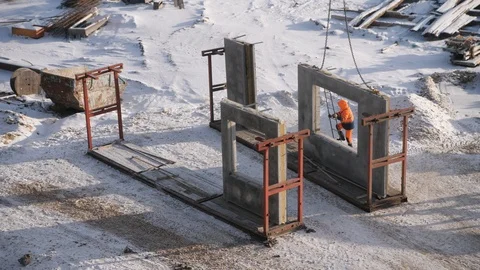 Employee goes down ladder leaned on reinforced wall panel Video stock 124607904
