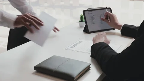 Employee handed over a document envelope and a box of work equipment beside h Stock Footage 155265108
