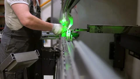 The employee hands are not bending the large parts of the metal Stock-Footage 201820157