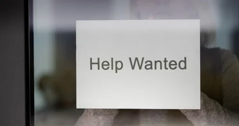 Employee hangs on the door ad Help Wanted Stock Footage