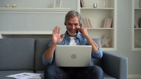 Employee of helpline technic support helps to client distantly through videocall Stock Footage 139751684