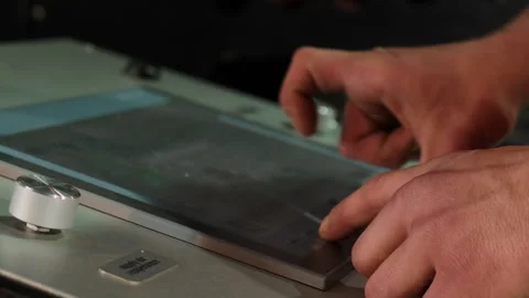 Employee inputs data for machine tool via touchscreen panel Stock Footage 266143040