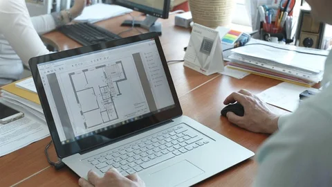 The employee on the laptop develops projects and schemes 스톡 동영상 79767089