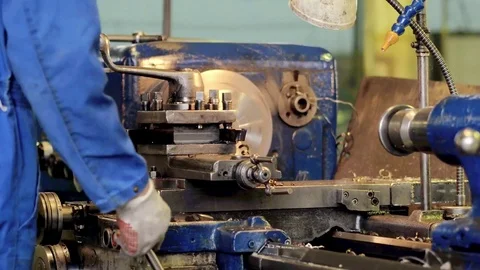 Employee-machine-operator-controls-metalworking-details-and-parts Stock Footage 126231793