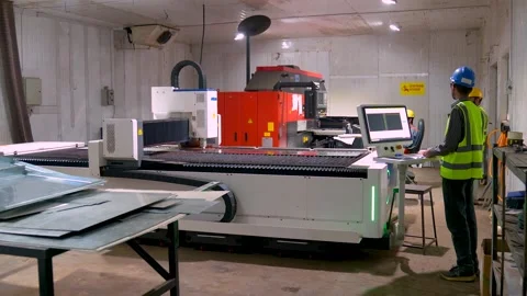 Employee Of A Metalworking Plant Programming And Operating A Industrial CNC Stock Footage 327852017