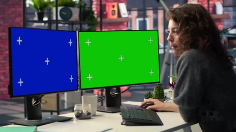 Employee in office working on PC with isolated copy space on dual monitors Stock Footage 308604174
