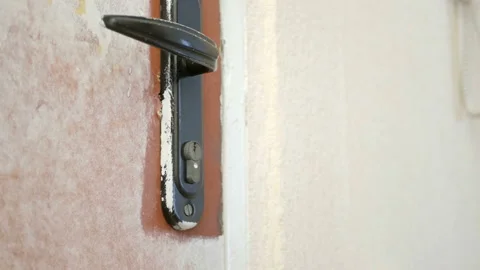 The employee opens the door lock. Stock Footage 95008561
