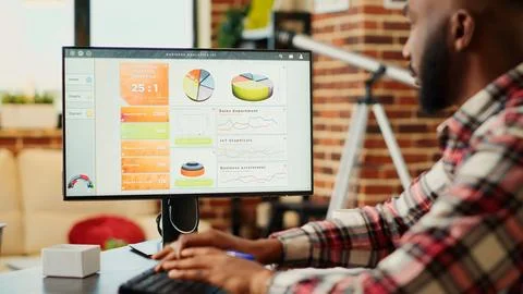 Employee optimizing market performance Stock Photos
