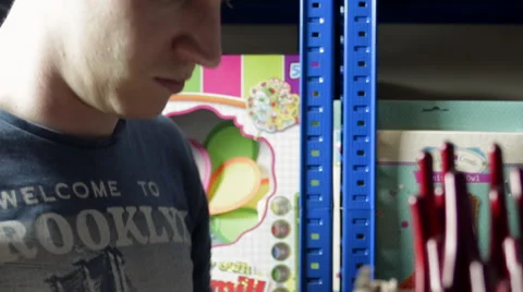 Employee Picking Items from a Shelf Stock Footage 62680075