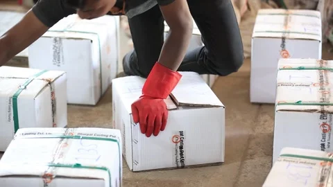Employee preparing dispatch box for the delivery. Video stock 302986983