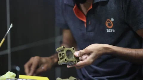 Employee preparing lost wax part for the precision casting. Stock Footage 297739390