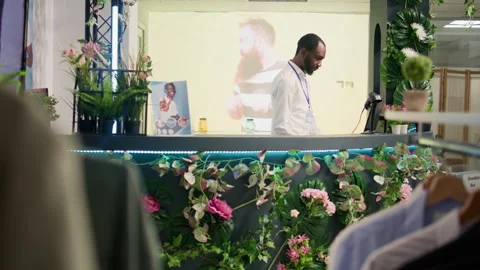 Employee processing clothes refund Video stock 255809748