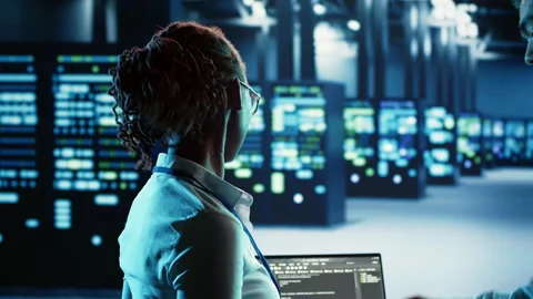 Employee programming in data center Stock Footage 249564926