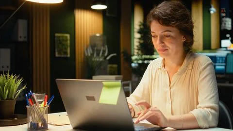 Employee proofreading and fact checking financial data Stock Photos