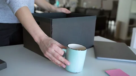 Employee Putting His Stuff From Work Desk In Black Carton Box, Leaving Job Stock Footage 148126716