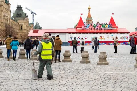 The employee at the red square. Stock Photos