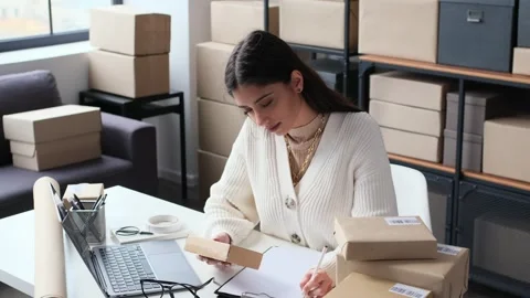 Employee Revising A Warehouse With Parcels Using Laptop 스톡 동영상 266154999