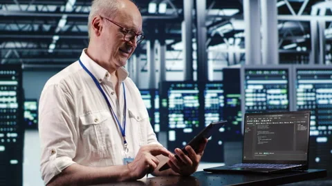 Employee running code in data center Stock Footage 247900867