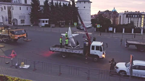Employee securely fastens object to cable aerial view Stock-Footage 253820247