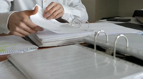 Employee, seeking documents in binders Stock Footage 61505506