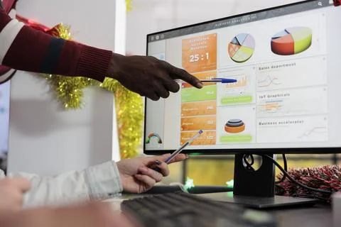 Employee showing data on computer screen 写真素材