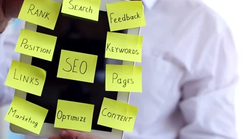 Employee shows SEO optimization notes on tablet Stock Footage 135829563