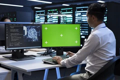 Employee solving tasks on mockup PC in server hub used for AI deep learning 写真素材