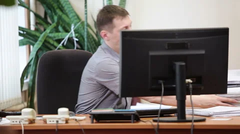 Employee starting to work, sorting paper documents at the desk Video stock 48919158