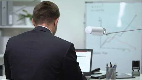 Employee suffering neck pain while working on laptop, health problems, tension 動画素材 117190109