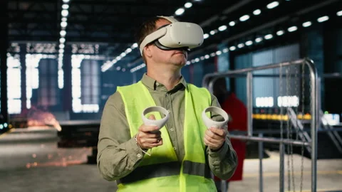 Employee uses VR headset to test 3D simulation concepts for heavy machinery 库存影片 321916868