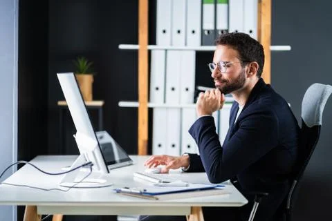 Employee Using Business Computer Stock Photos