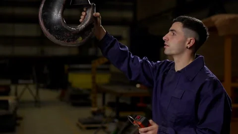 Employee using crane in a factory Stock Footage 267156292