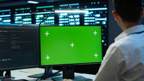 Employee using green screen devices in server farm used for automation Stock Photos