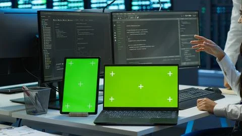 Employee using green screen devices in server farm used for automation Stock Photos